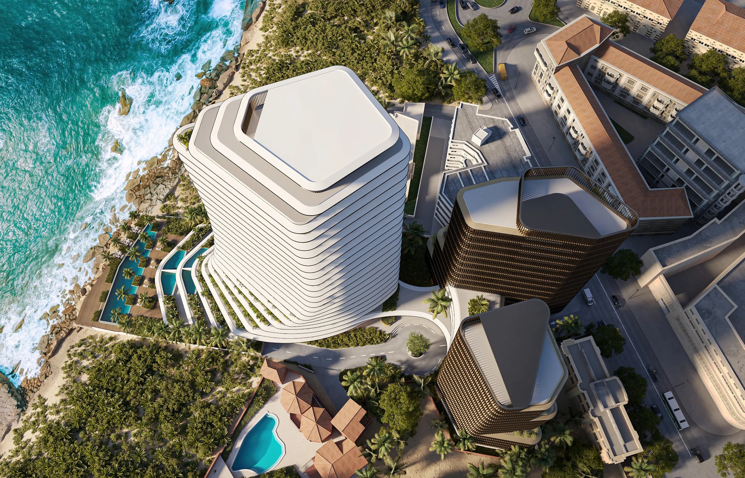 Aerial view of curved luxury towers on a Dubai coastline
